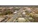 Aerial view of a bustling intersection surrounded by commercial buildings and dense foliage at 472 Burton Dr, Alpharetta, GA 30009