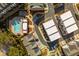 Aerial view showcases the meticulously planned community with a pool, clubhouse, and modern townhomes at 472 Burton Dr, Alpharetta, GA 30009
