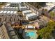 Comprehensive aerial view of a well-planned residential community with modern townhomes, a pool, and lush landscaping at 472 Burton Dr, Alpharetta, GA 30009