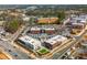 Aerial view showcasing mixed-use development with commercial and residential areas surrounded by trees at 472 Burton Dr, Alpharetta, GA 30009