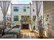 Relaxing outdoor balcony with comfortable seating, potted plants, and privacy curtains for an inviting retreat at 472 Burton Dr, Alpharetta, GA 30009