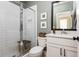 Bathroom featuring a white vanity, framed mirror, shower with glass door, subway tile, and toilet at 472 Burton Dr, Alpharetta, GA 30009