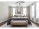 Cozy bedroom featuring soft lighting, neutral tones, and stylish furniture at 472 Burton Dr, Alpharetta, GA 30009