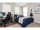 Bedroom featuring a queen bed, wood floors, neutral walls, and accent furniture at 472 Burton Dr, Alpharetta, GA 30009