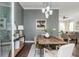 Stylish dining room offers seamless flow to the living area and kitchen at 472 Burton Dr, Alpharetta, GA 30009