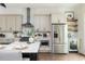 Well-equipped kitchen with stainless steel appliances and a convenient beverage fridge at 472 Burton Dr, Alpharetta, GA 30009