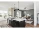 Bright kitchen with a farmhouse sink that opens to the dining room at 472 Burton Dr, Alpharetta, GA 30009