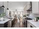 Open-concept kitchen showcases stainless steel appliances and seamless flow to the living area at 472 Burton Dr, Alpharetta, GA 30009