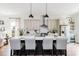 Spacious open concept kitchen featuring stainless steel appliances, a large island, and bar seating at 472 Burton Dr, Alpharetta, GA 30009