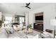 Open-concept living area with modern media center, and seamless flow to the dining and kitchen areas at 472 Burton Dr, Alpharetta, GA 30009