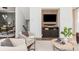 Comfortable living room featuring stylish furniture, a modern media center, and neutral decor at 472 Burton Dr, Alpharetta, GA 30009