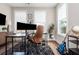 Bright home office with a large desk, ergonomic chair, and plenty of natural light at 472 Burton Dr, Alpharetta, GA 30009
