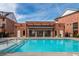 Sparkling community pool and brick clubhouse creating an ideal spot for relaxation and socializing at 472 Burton Dr, Alpharetta, GA 30009