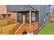 Newly built back porch with wooden railings and natural surroundings at 701 Smith St, Atlanta, GA 30310