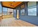 Spacious rear porch with wooden flooring and ceiling fan at 701 Smith St, Atlanta, GA 30310