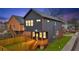View of the backyard featuring a wooden deck, privacy fence, and well-maintained lawn at 701 Smith St, Atlanta, GA 30310