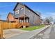 View of the backyard featuring a wooden deck, privacy fence, and well-maintained lawn at 701 Smith St, Atlanta, GA 30310