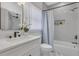 Bright bathroom featuring a shower over a tub and marble floors at 701 Smith St, Atlanta, GA 30310