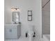 Modern bathroom with white vanity, patterned tile flooring, and open shelving at 701 Smith St, Atlanta, GA 30310