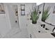 Modern bathroom with white vanity, sleek fixtures, decorative mirror, and elegant marble flooring at 701 Smith St, Atlanta, GA 30310