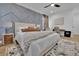 Stylish bedroom with a cozy rug, textured gray accent wall, and modern furniture at 701 Smith St, Atlanta, GA 30310