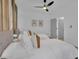 Bright bedroom with soft, neutral decor, a ceiling fan, and light hardwood flooring at 701 Smith St, Atlanta, GA 30310