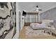 Bright bedroom with a decorative accent wall, modern furnishings, and ample natural light at 701 Smith St, Atlanta, GA 30310
