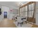 Bright dining room with modern light fixture and tan sheer curtains at 701 Smith St, Atlanta, GA 30310