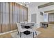 Bright dining room with modern light fixture and tan sheer curtains at 701 Smith St, Atlanta, GA 30310