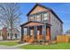 Charming two-story home with a inviting front porch and beautiful wood accents and well-maintained lawn at 701 Smith St, Atlanta, GA 30310