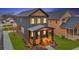 Beautiful two-story home with a inviting front porch, wood accents and well-maintained lawn at 701 Smith St, Atlanta, GA 30310