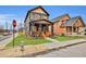 Charming two-story home with a inviting front porch and beautiful wood accents and well-maintained lawn at 701 Smith St, Atlanta, GA 30310