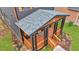 Inviting covered front porch with wooden beams and railings offers a cozy outdoor space at 701 Smith St, Atlanta, GA 30310