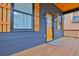 Cozy front porch with painted wood siding and stylish lighting at 701 Smith St, Atlanta, GA 30310