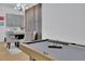 Game room with a pool table and modern dining area with a chandelier and window at 701 Smith St, Atlanta, GA 30310