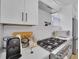White kitchen with modern appliances and white subway tile backsplash at 701 Smith St, Atlanta, GA 30310