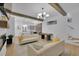 Spacious living area with a billiard table, fireplace, beamed ceilings, and modern furnishings at 701 Smith St, Atlanta, GA 30310