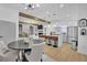 Open concept living area with modern lighting and stainless steel appliances at 701 Smith St, Atlanta, GA 30310