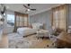 Inviting primary bedroom featuring a decorative accent wall and cozy seating area at 701 Smith St, Atlanta, GA 30310