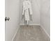 A well-organized walk-in closet with a plush carpet and a neatly hung white bathrobe at 106 Holt Ln, Lawrenceville, GA 30046