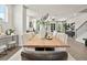 Open concept dining room with a wooden table, upholstered chairs, and modern decor at 106 Holt Ln, Lawrenceville, GA 30046