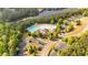Aerial view of the community pool and clubhouse area, with lake and green space nearby at 120 Generals Pl, Canton, GA 30114