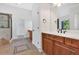 A well-lit bathroom features double sinks, tiled floors, a glass shower, and a walk-in closet at 120 Generals Pl, Canton, GA 30114