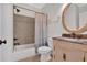 Cozy bathroom with shower-tub combo, decorative vanity, and tiled flooring at 120 Generals Pl, Canton, GA 30114