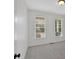 Neutral bedroom with large windows that provide lots of natural light, and plush carpeting at 120 Generals Pl, Canton, GA 30114