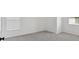 Empty bedroom showing two windows and neutral-colored carpet at 120 Generals Pl, Canton, GA 30114