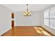 Bright and spacious dining room with hardwood floors, wainscoting, and an elegant chandelier at 120 Generals Pl, Canton, GA 30114