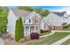 Well-kept home showcases a brick and siding exterior, complemented by lush landscaping and a paved walkway at 120 Generals Pl, Canton, GA 30114