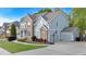 Side view of a brick and siding home with an attached garage and well-maintained landscaping at 120 Generals Pl, Canton, GA 30114