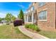 Brick home with a covered front porch, featuring elegant columns, a sidewalk, and manicured landscaping at 120 Generals Pl, Canton, GA 30114